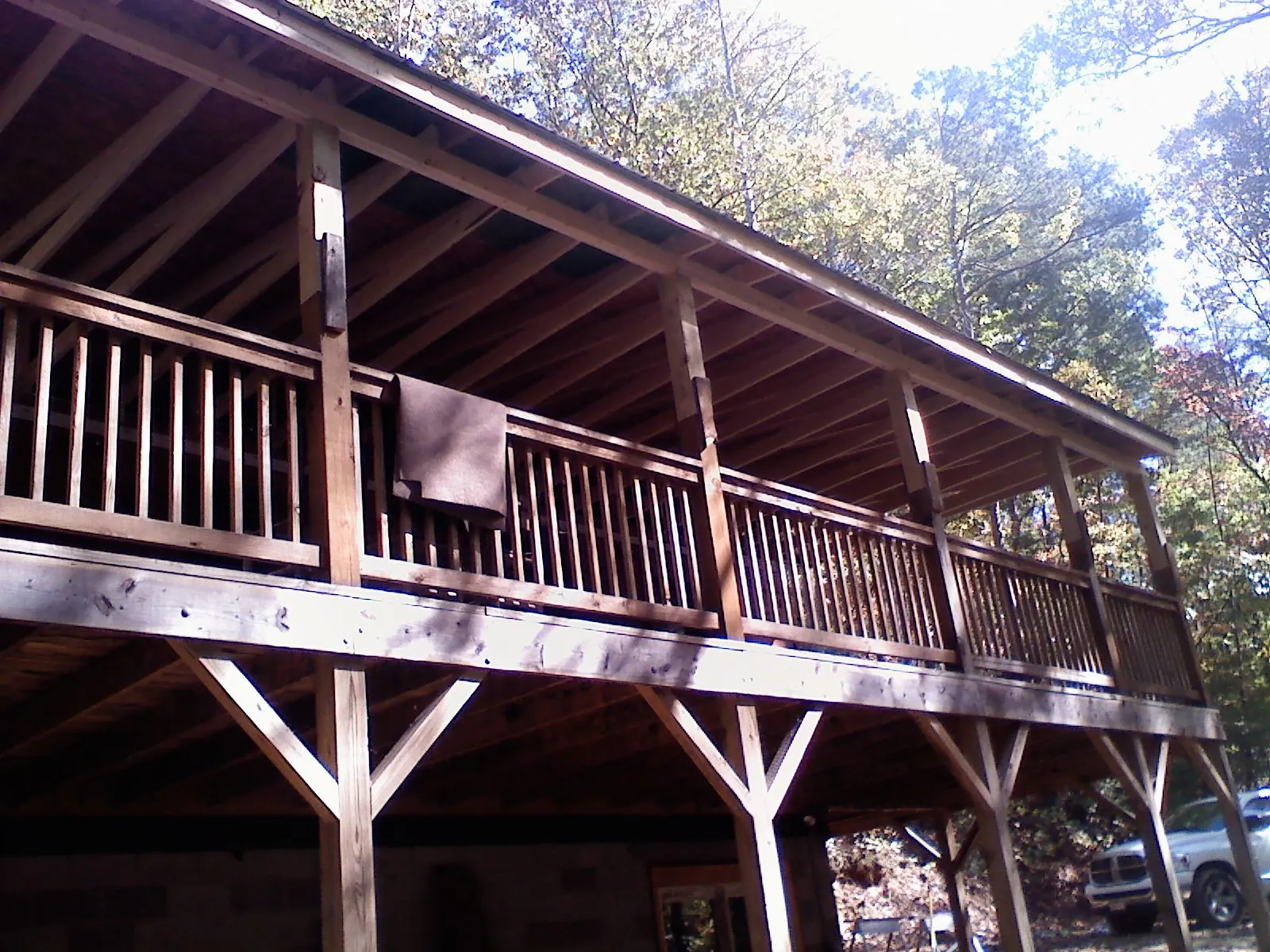 Timber framing under a new elevated porch and deck — Roof Leak Repair in Alger by Roofing Brothers
